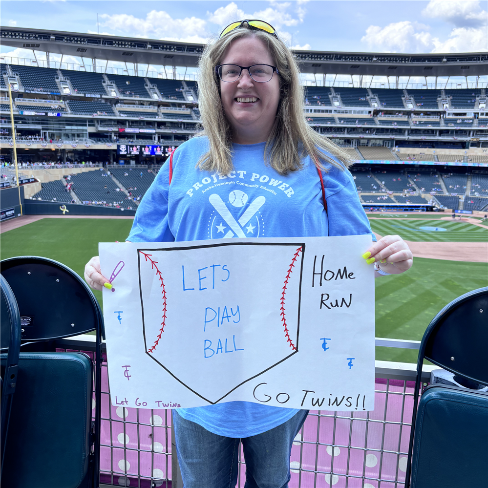 Woman holding a sign at Target Field